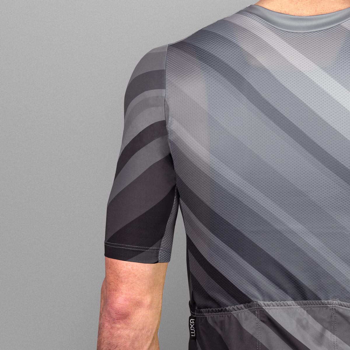 jerseys are form-fitting and made from lightweight, breathable materials, with subtle accents in black and gray.